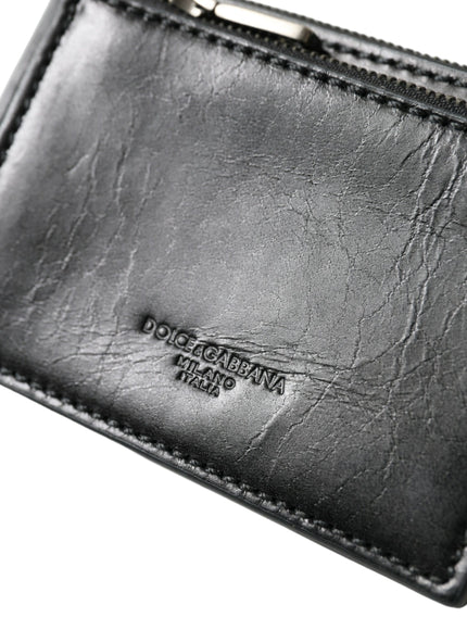 a black leather wallet with a metal clip