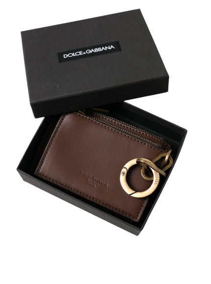 a brown wallet with a gold ring on it