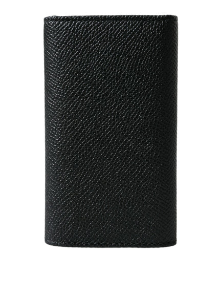 a black leather wallet on a white background