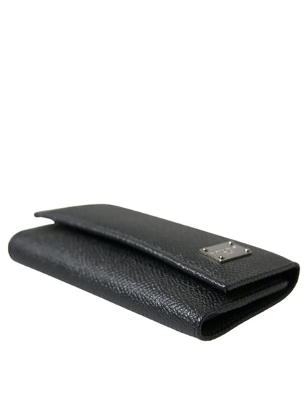 a black leather case with a metal clasp