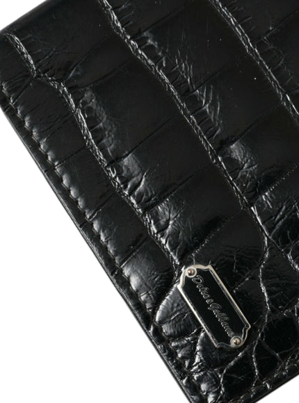 a black leather wallet with a metal buckle