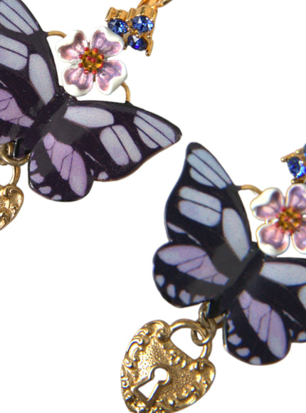 a close up of two butterflies on a chain