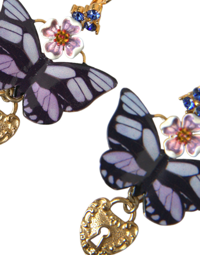 a close up of two butterflies on a chain