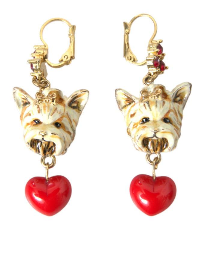 a pair of earrings with a dog and a heart