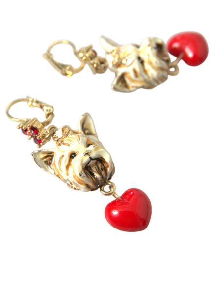 a pair of earrings with a dog and a heart