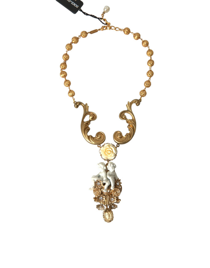 a necklace with a gold and white design on it