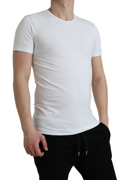 a man wearing a white shirt and black pants