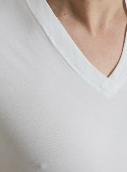 a close up of a person wearing a white shirt