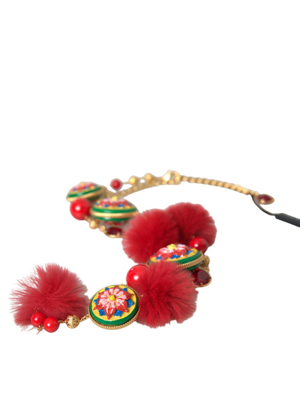 a pair of red and green bracelets with pom poms