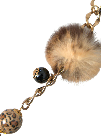 a key chain with a fur ball on it