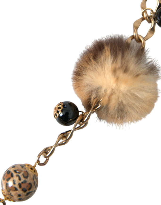 a key chain with a fur ball on it