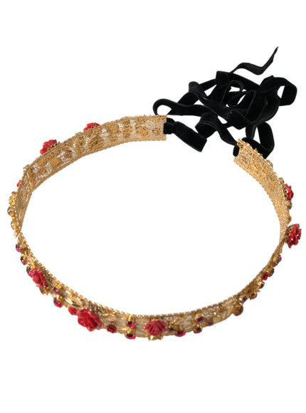 a gold headband with red beads and a black bow