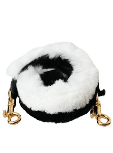 a black and white furry dog leash