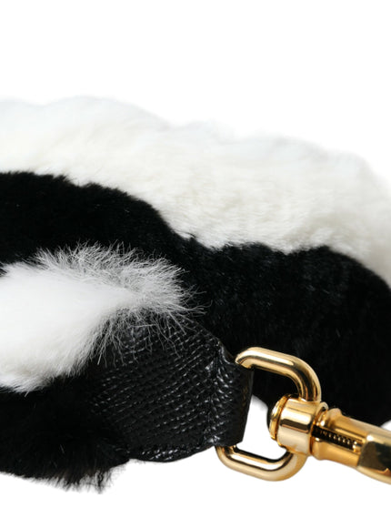 a close up of a black and white dog leash