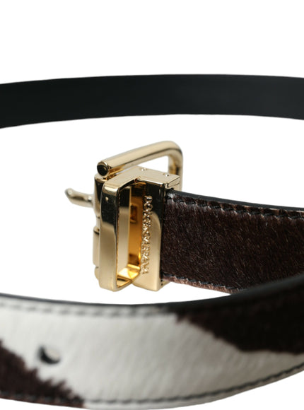 a close up of a belt with a gold buckle