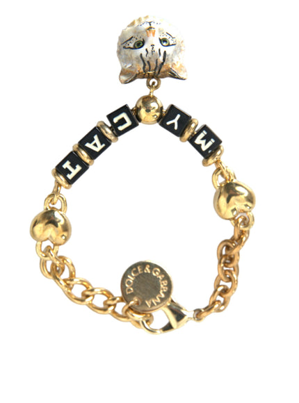 a gold bracelet with a charm that says nach on it