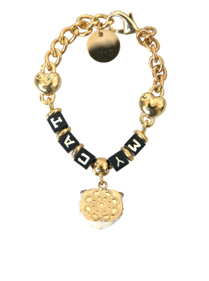 a gold bracelet with a heart charm