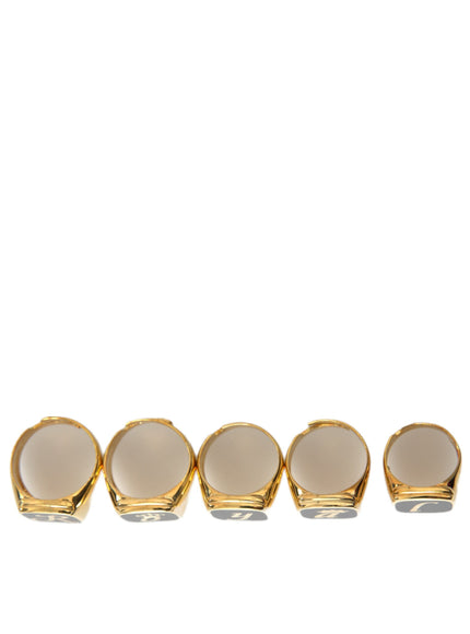 a set of four gold plated dishes on a white background