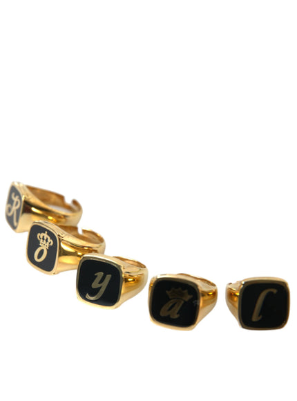 a set of three gold and black rings