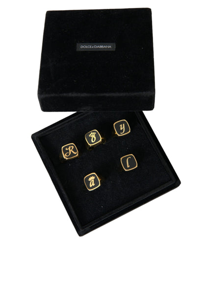 a set of four gold cufflinks in a black box