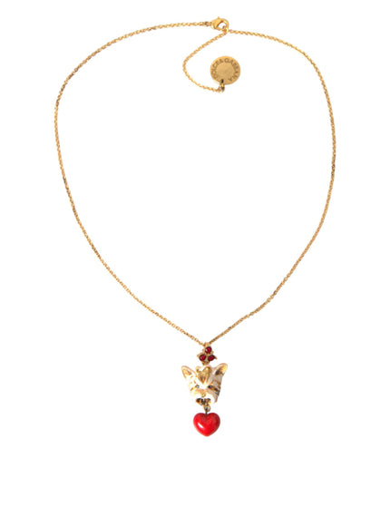 a gold necklace with a red heart on it