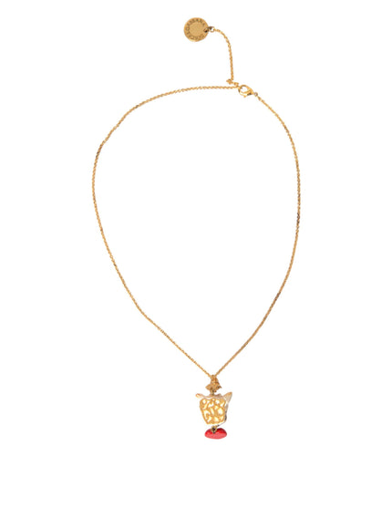 a gold necklace with a red stone on it