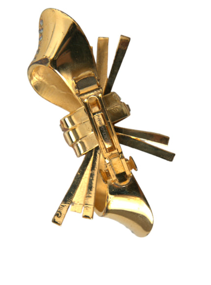 a gold brooch with a bunch of keys attached to it