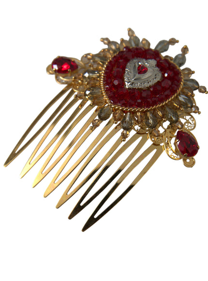 a close up of a hair comb with a red brooch