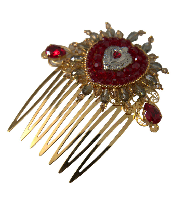 a close up of a hair comb with a red brooch