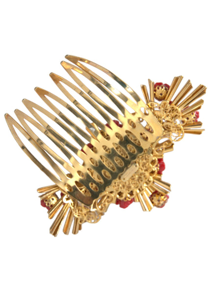 a close up of a gold comb with red beads