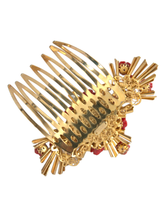 a close up of a gold comb with red beads