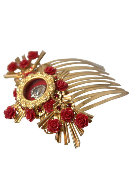 a gold brooch with red roses and a picture