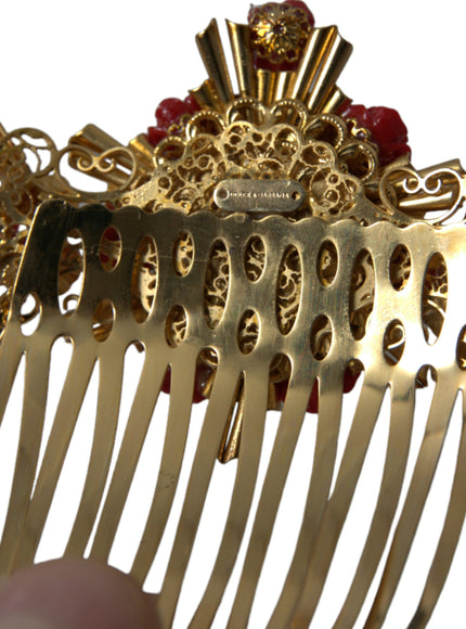 a close up of a gold comb with red beads