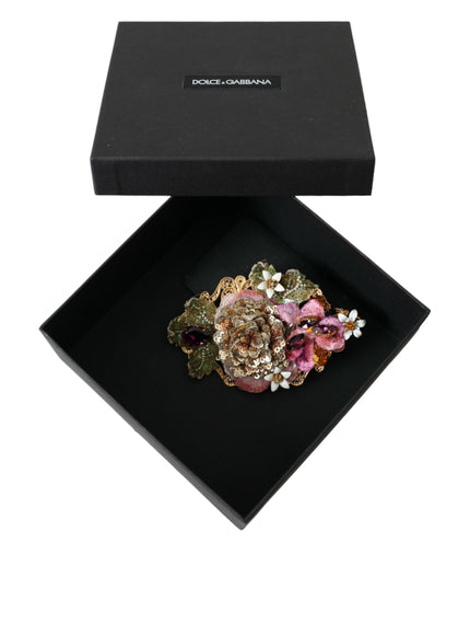 a black box with a flower brooch in it