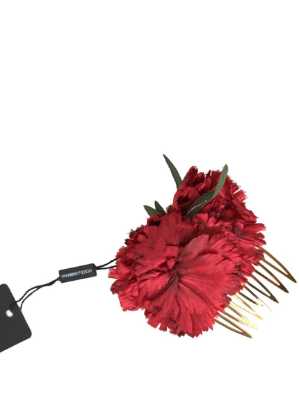 a red flower with a hair comb attached to it