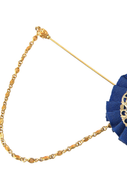 a blue brooch with a gold chain around it