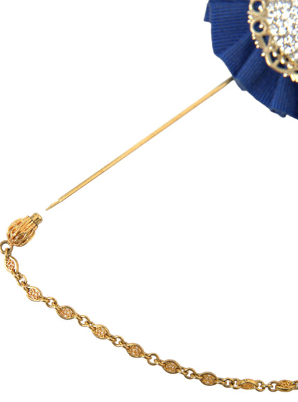 a blue pin with a chain around it