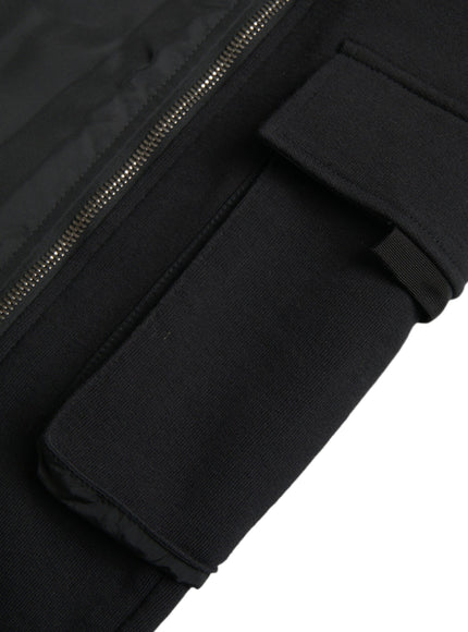 a close up of a black jacket with zippers