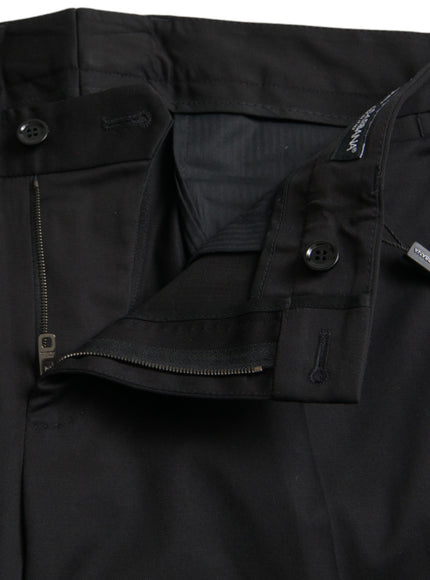 a close up of a black pants with zippers