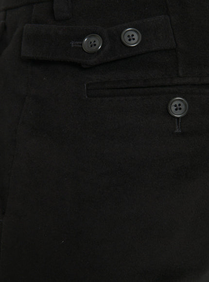 a close up of a person wearing a pair of black pants