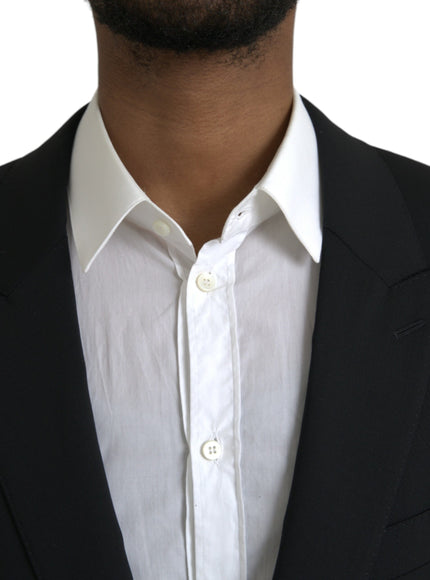 a close up of a person wearing a suit and tie