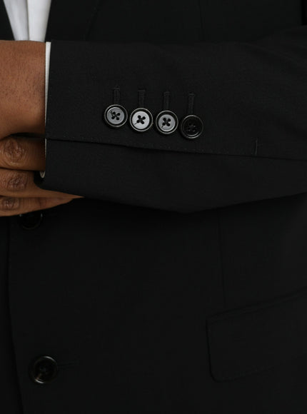 a close up of a person wearing a suit and tie