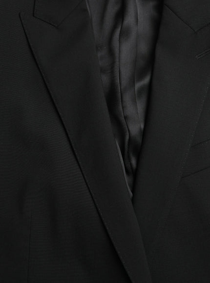 a close up of a black suit and tie