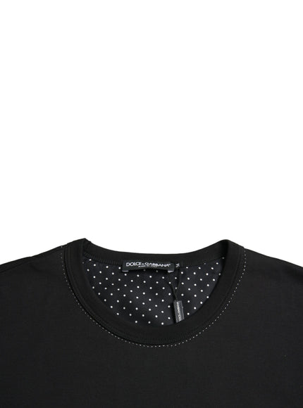 a black shirt with white polka dots on it