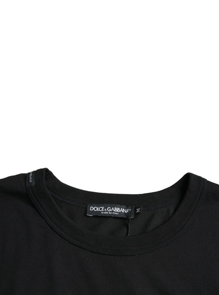 a black t - shirt with a black logo on the chest