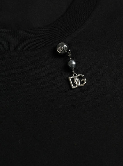 a close up of a black shirt with a necklace on it