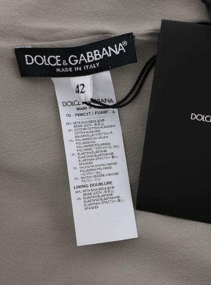 a dolce and garbana brand tag on a bed