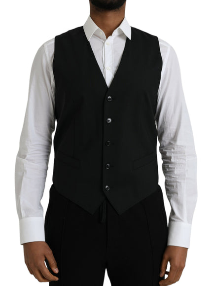 a man wearing a black vest and white shirt