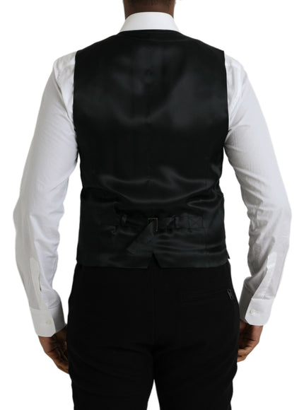 a man wearing a black vest and white shirt