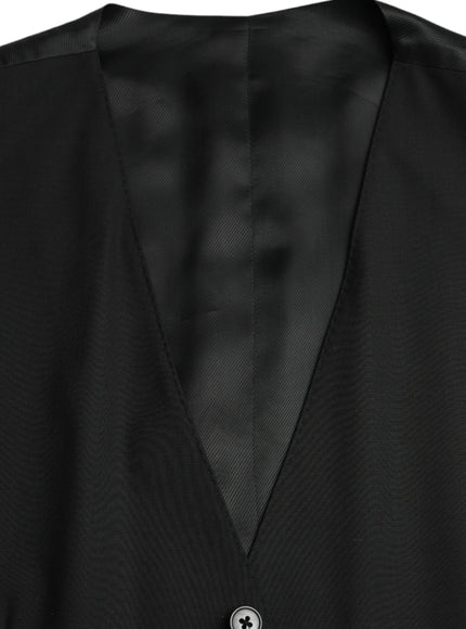 a close up of a black jacket with a button